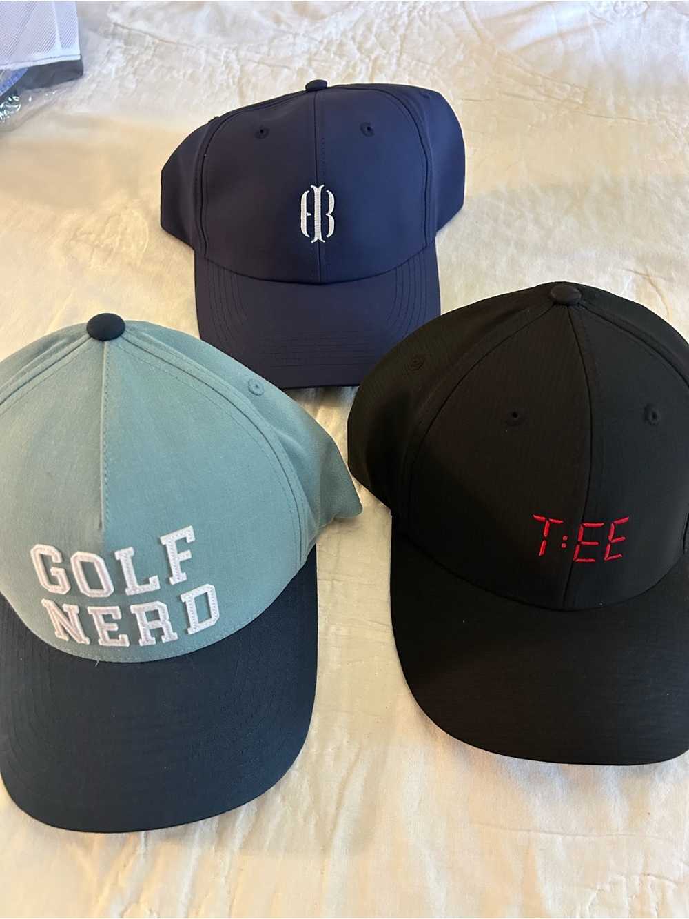 2 golf caps by Travis Matthew, Waggle
